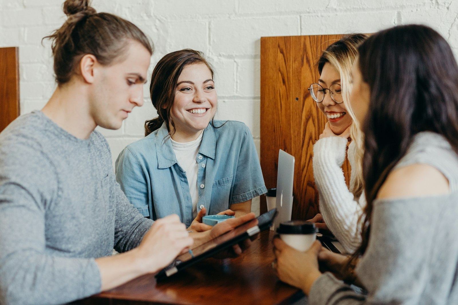 Two people in conversation over coffee